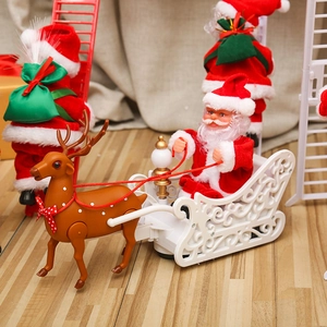 Detailed view of an electric Santa Claus toy with brown reindeer and a red festive sleigh