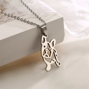 Detailed close-up of a hollow French Bulldog pendant necklace in silver stainless steel
