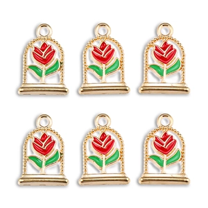 Detailed view of red rose alloy pendants with gold bezels for DIY jewelry making