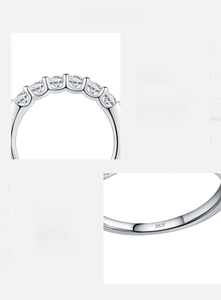 Macro detail of S925 hallmark on a polished silver ring with D color Moissanite