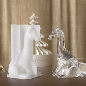 Detailed view of 3D giraffe silicone mold with finished resin statue for DIY crafts