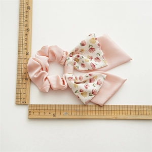 Pink floral double layer bow scrunchie made of satin fabric with 16cm diameter scale