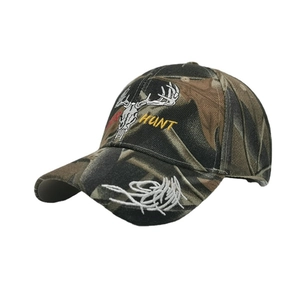 Camouflage baseball cap with embroidered HUNT logo and deer skull on white background