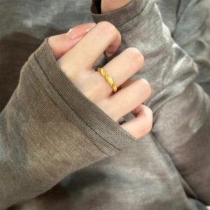 Elegant gold plated twisted open ring with frosted sand finish on finger