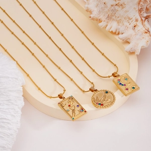 Gold plated tarot pendant necklaces featuring sun moon star motifs and crystal inlay