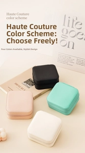 Detailed view of four colorful mini travel jewelry boxes with premium cross-grain texture