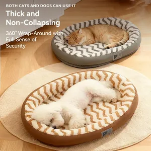 Plush leather pet bed in gray and brown for cats and small dogs on a warm wooden floor