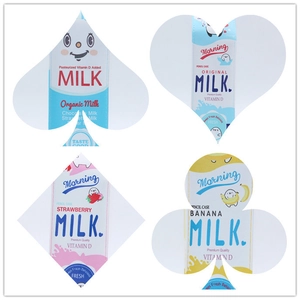 Detail view of colorful milk carton pencil cases with cute cartoon designs and patterns