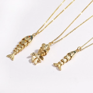 Three gold koi fish pendant necklaces in stainless steel arranged on white background