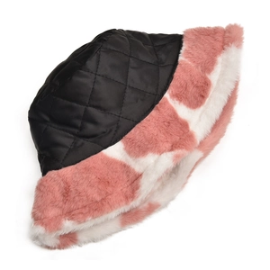 Detail of winter bucket hat with black quilted pattern and pink cow print plush fur