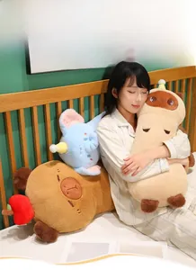 Detail of soft plush animal bolster cushion featuring cute expressions and fruit accents
