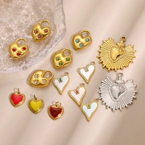 Collection of stainless steel heart pendants with sacred heart and enamel designs