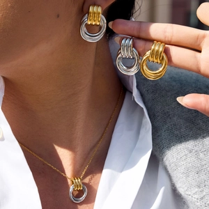 Minimalist gold and silver layered ring jewelry set with necklace and earrings