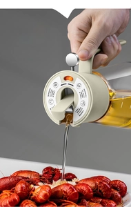 Action shot of 600ml glass oil dispenser pouring oil over food with gravity lid