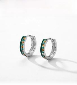 Close-up of S925 silver hoop earring with dark green enamel and colored zircons