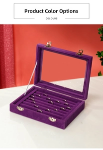 Detail of purple velvet jewelry box with 24 compartments and transparent glass lid