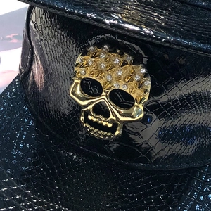 Black faux crocodile leather flat brim baseball cap with gold skull and rhinestone detail