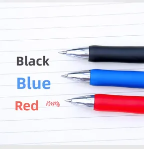 Macro shot of 0.5mm retractable gel pens in black blue and red on lined paper