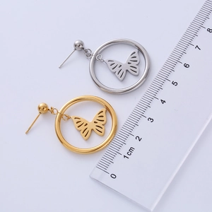 Detailed view of butterfly earrings with size scale in gold and silver finish