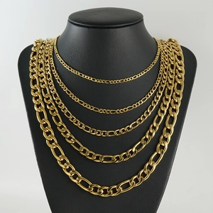 Five-piece gold Figaro chain necklace set displayed on a black neck mannequin