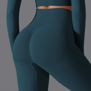 Detailed view of high waisted teal seamless yoga leggings with scrunch butt lift texture