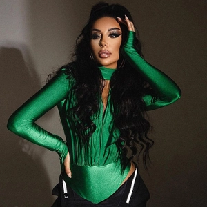 Detail of green long-sleeve bodysuit with V-neckline and pleated fabric texture