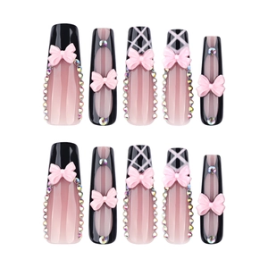 Extra long coffin press-on nails in pink and black with 3D bows and rhinestones