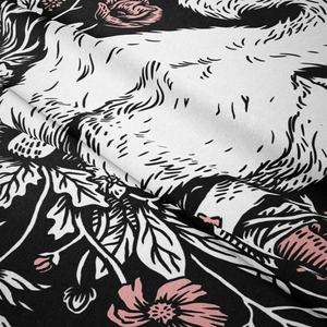 Detailed close-up showing texture and floral print on soft black wall tapestry