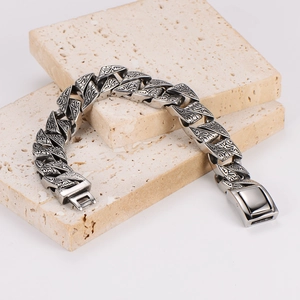 Retro stainless steel chain bracelet for men featuring engraved vine patterns and box clasp