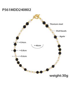 Detail view of OT buckle necklace with black agate, shell beads, and titanium steel specs