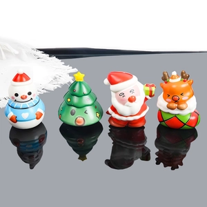 Set of four colorful Christmas Squishy toys featuring Santa, deer, snowman and tree