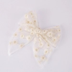 White tulle bow hair clip with daisy embroidery and hanging ribbons for girls