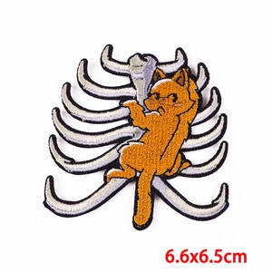 Embroidered orange cat hugging rib cage skeleton iron-on patch, size 6.6x6.5cm