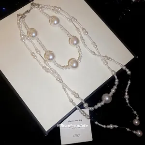French vintage multilayer pearl necklace with tiered strands and elegant metallic clasp