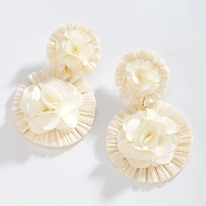 Handmade raffia flower earrings in off-white fabric and bohemian geometric design