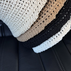 Detailed macro shot showing hollow knit texture and color options of foldable sun hats
