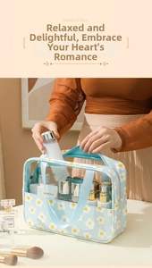 Detail of floral makeup bag with transparent PVC window and top handle for travel