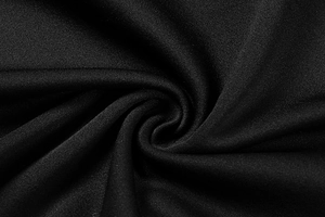 Macro detail of the black pleated fabric showing fine mesh texture and soft drape