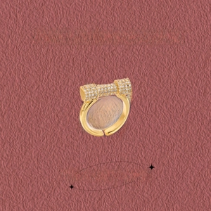 Detailed macro view of geometric horseshoe ring with brilliant pavé zircon stones on gold
