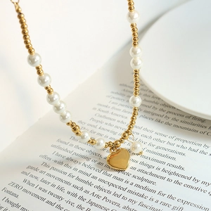 Handmade pearl and gold beaded heart pendant necklace in 18k plated stainless steel