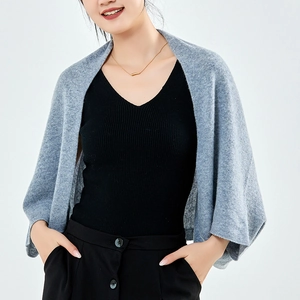 Gray knitted cashmere shawl wrap cardigan for women shown on a model against a plain background