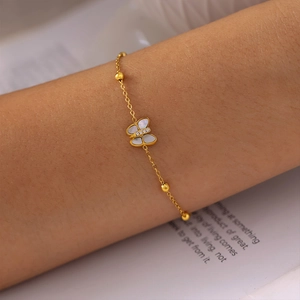 18k gold plated butterfly bracelet with natural shell and cubic zirconia on model