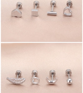 Close-up of various stainless steel geometric stud earrings with secure screw backs