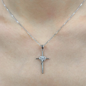 Elegant S925 silver infinity cross necklace with heart moissanite pendant on a model