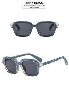 Detail of gray-black sunglasses featuring trendy wavy texture frames and tinted lenses