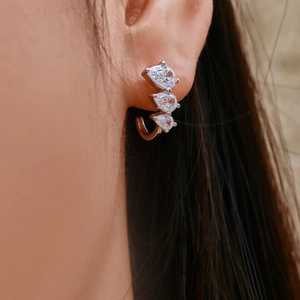 Elegant S925 silver C-shape earring with triple teardrop zircons worn on model