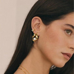 French vintage gold U-shaped stainless steel earrings with elegant pearls on model