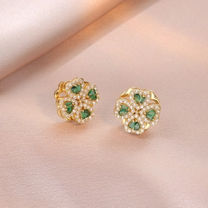 Elegant gold four-leaf clover stud earrings with green zircon gems and micro-pave crystals