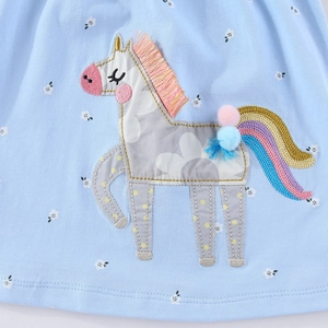 Short sleeve light blue knit princess dress with unicorn embroidery and tassel details