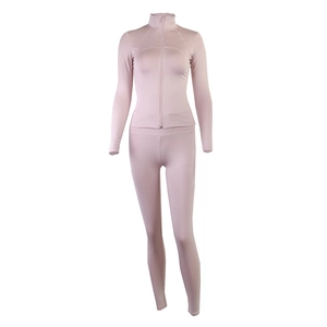 Detail of light pink yoga set featuring stand collar zip jacket and high waist leggings